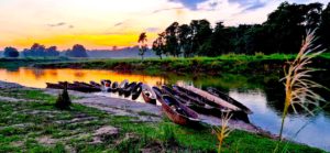 Chitwan Sunset and boats.